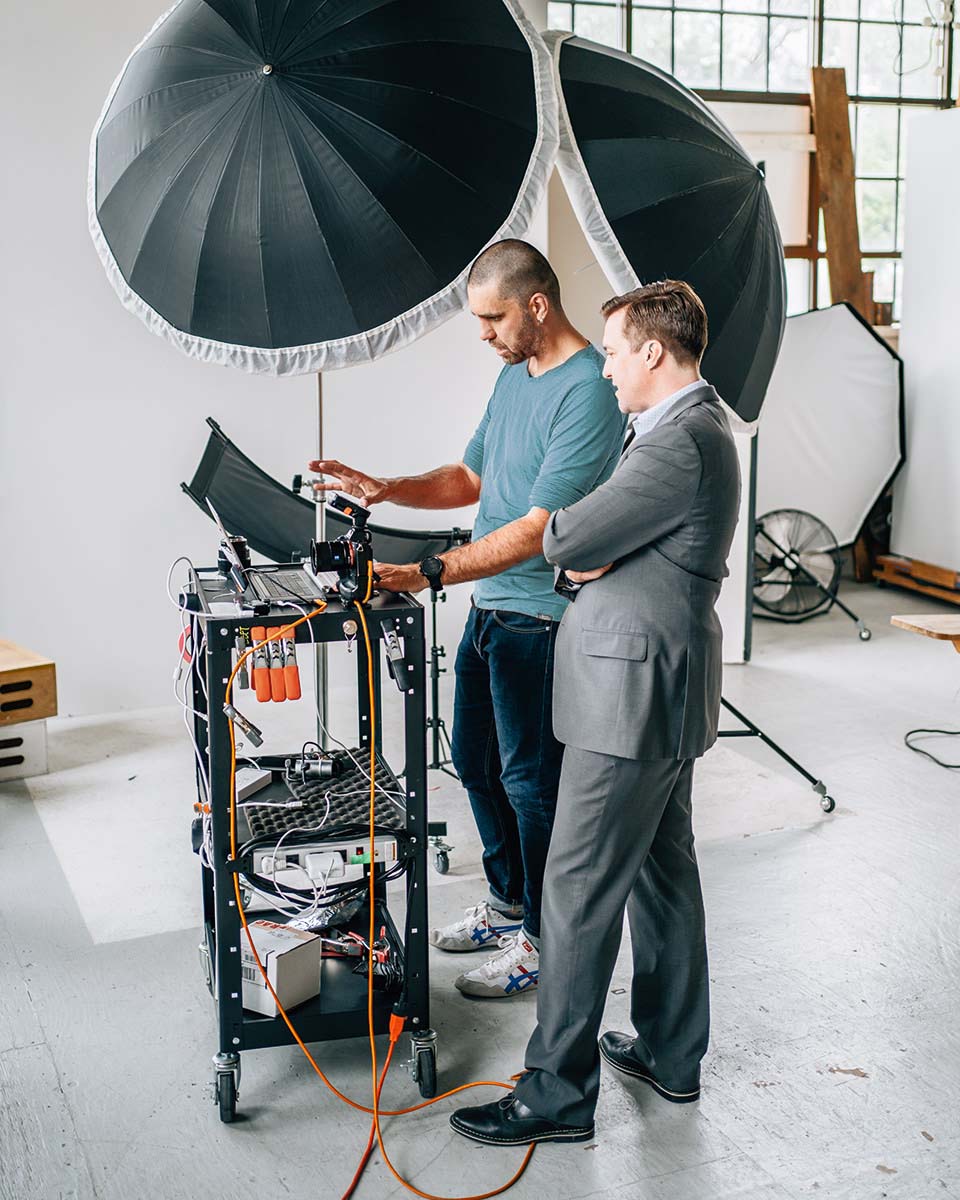 photographer discussing corporate headshots with a client in Madison WI studio